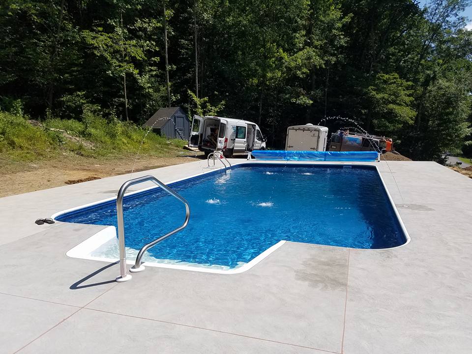 In-ground pool with entry steps and deck jets