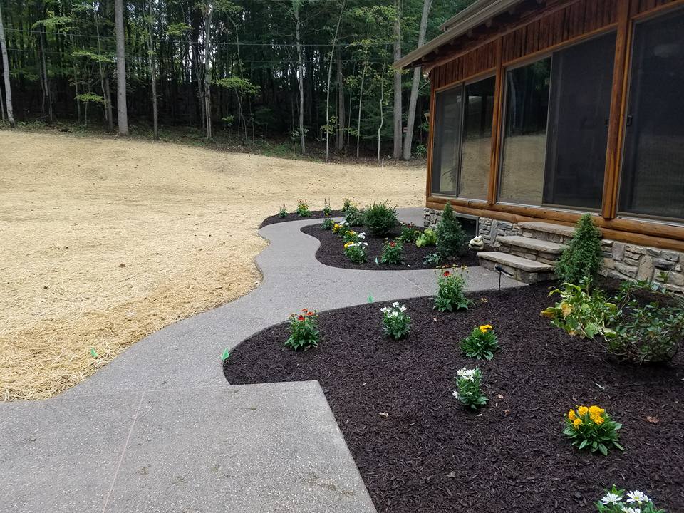 Custom concrete walkway beside a pool